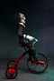 Saw Figura con sonido Billy con Triciclo 30 cm
