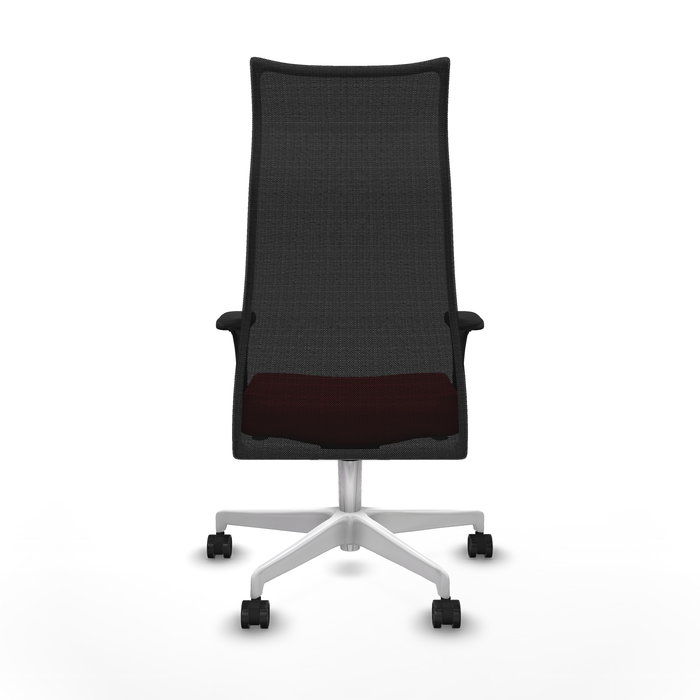 Sillón Albacete con mecanismo Sincro tapizada con Similpiel color Rojo y malla color Negro. Equipado con Base poliamida blanca, Brazos 1D y Ruedas 65mm nailon