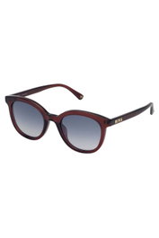 Nina Ricci SNR264-500AFD Gafas de sol para mujer con lentes grises y detalles rojos