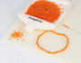 Innspiro Rocalla de vidrio redonda aurora boreale naranja 2,3mm 500g