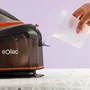 Solac CPB6110 Optima Center 3010 Centro de Planchado 3000W 1.5L 7 Bar Vapor 400g/min Smart ECO, Suela Cerámica - Negro, Naranja, Plata
