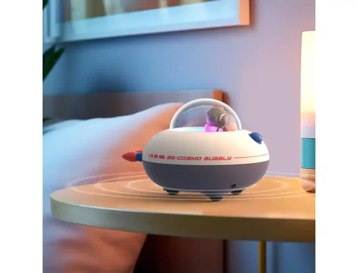 Wondee Cosmo Bubbly Altavoz Bluetooth Portátil Inalámbrico con Efectos de Luz, Diseño Nave Espacial, Sonido Potente, Luz Nocturna, Incluye 50 Pegatinas