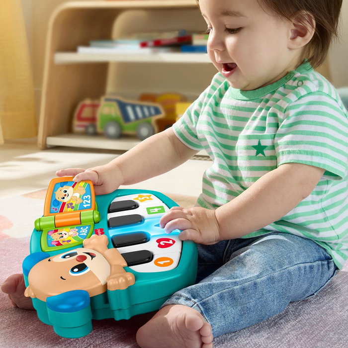 Fisher-Price Piano Perrito Ríe y Aprende JMM47 - Piano d'éveil électronique avec lumières, sons et phrases éducatives (Anglais, Français, Allemand, Espagnol)