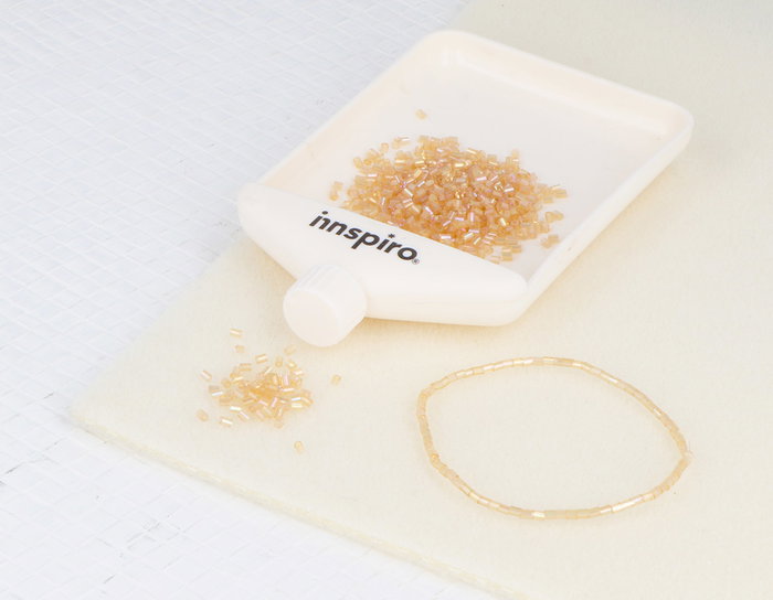 Innspiro Rocaille de verre cylindrique mini aurora boreal or 2x2mm 100g