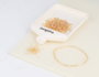 Innspiro Rocaille de verre cylindrique mini aurora boreal or 2x2mm 100g