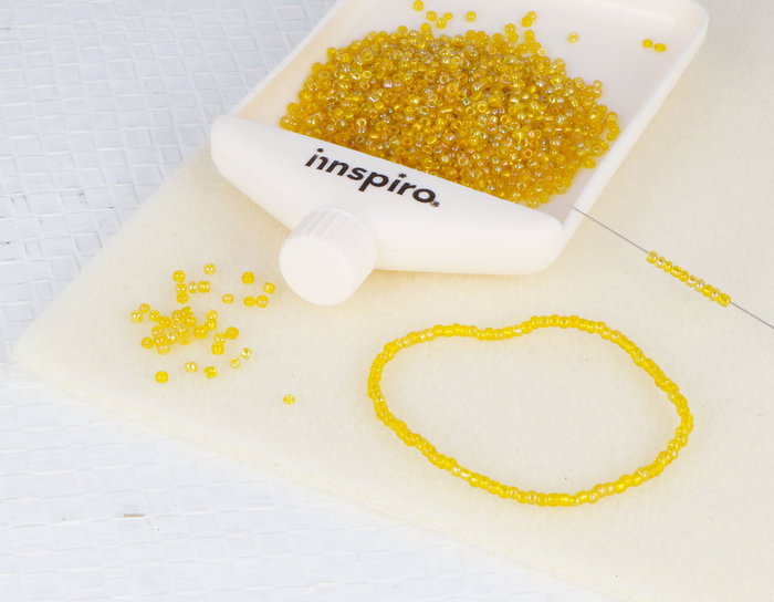 Innspiro Rocaille de verre ronde aurora boreale jaune 2,3mm 500g