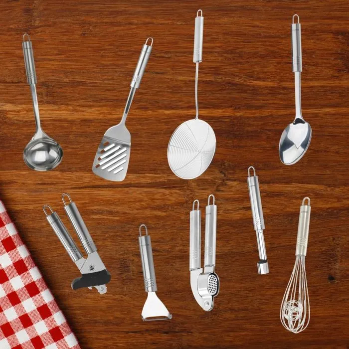 Fackelmann - Set de 9 ustensiles de cuisine en acier inoxydable, collection Ovale : Louche, écumoire, fouet, pelle, cuillère, presse-ail, éplucheur, vide-pommes, ouvre-boîtes