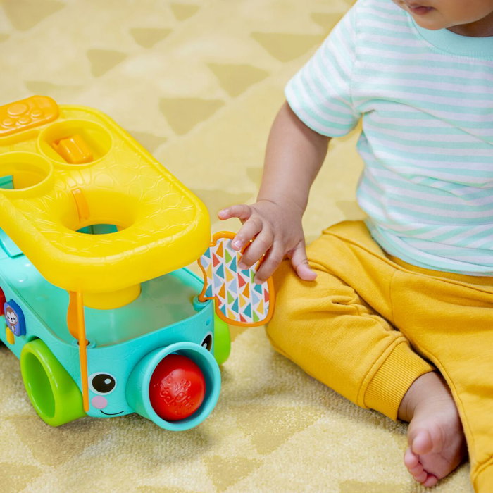 Bright Starts Pop & Roll Safari Bus - Jouet à tirer avec lanceur de balles et mélodies