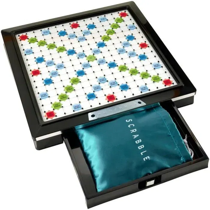 Mattel Games - Scrabble Deluxe - Jeu de société de lettres avec plateau tournant et encoches - Version noir et argent - À partir de 10 ans - 2 à 4 joueurs Mattel Games - Scrabble Deluxe - Jeu de société de lettres avec plateau tournant et encoches - Version noir et argent - À partir de 10 ans - 2 à 4 joueurs