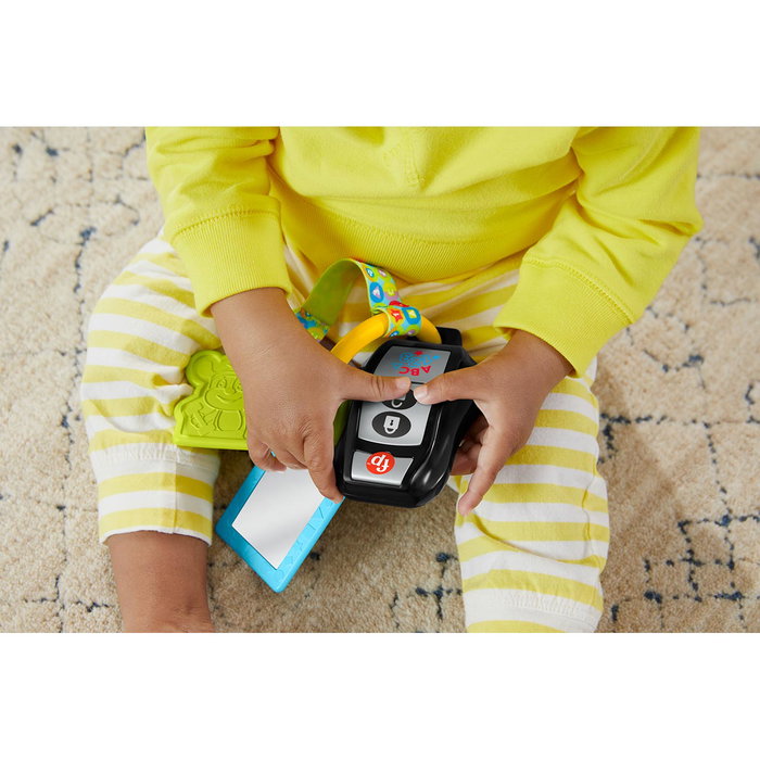Fisher-Price Llavero Hwy38 - Anneau d'activités pour bébé +6 mois avec 4 jouets, musique, miroir et mordoir, multilingue