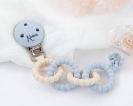 KioKids Attache-tétine en silicone bleu à anneaux, pour bébé dès la naissance, design scandinave, hygiénique et durable avec pince en acier inoxydable