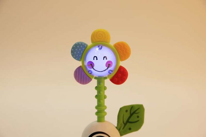 Hape - Sonajero-mordedor flor shake & sparkle rattle 0-18 m - Jouet d'éveil et anneau de dentition pour bébé de 0 à 18 mois