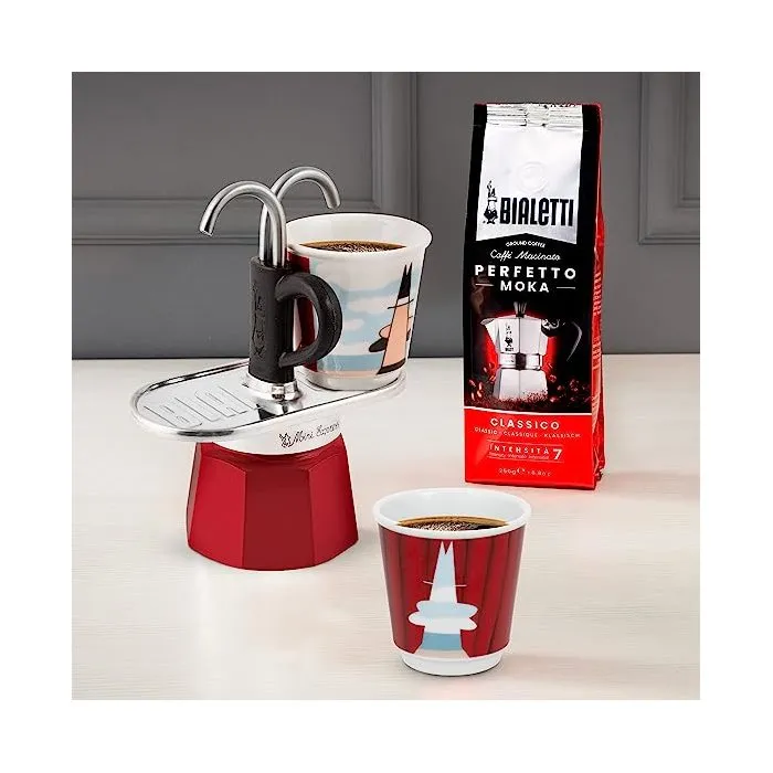 Bialetti Mini-Express Magritte - Cafetière italienne inox rouge avec 2 tasses à expresso - Set complet