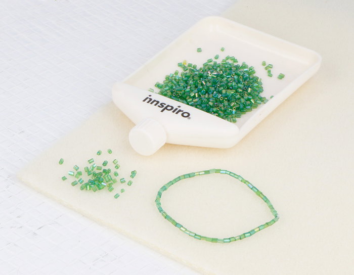 Innspiro Rocaille de verre cylindre mini aurora boreale vert foncé 2x2mm 100g