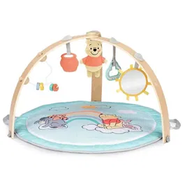 Bright Starts Tapis d'éveil évolutif bébé Disney Baby Winnie, réversible et pliable, avec arche en bois, jouets sensoriels et musicaux, miroir, 5 jouets amovibles