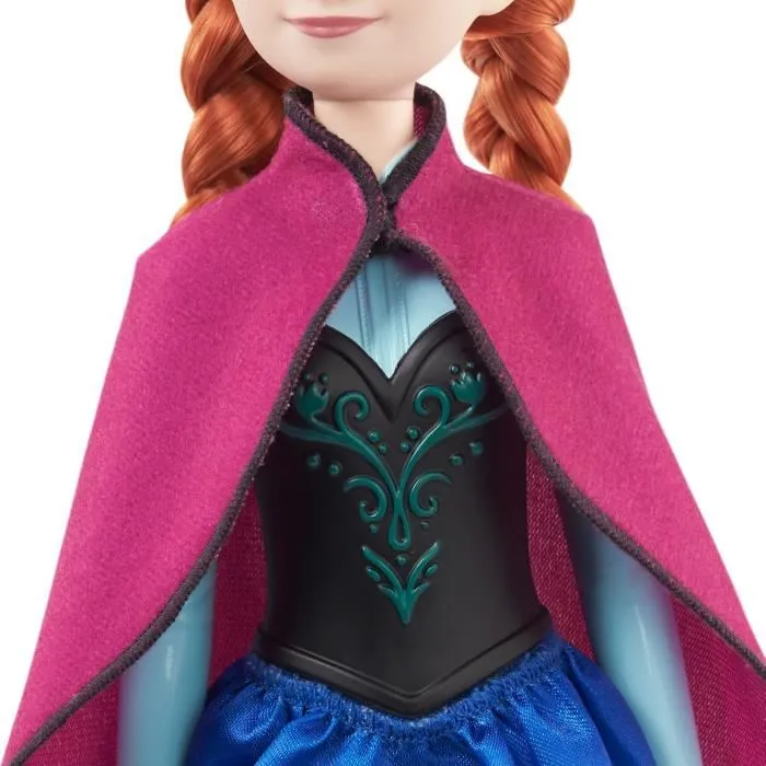 Mattel Disney Frozen Anna HLW49 - Poupée mannequin Princesse La Reine des Neiges avec tenue de voyage, cape, jupe et accessoires amovibles