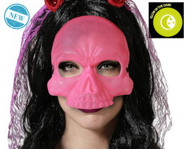 Masque de crâne rose brillant dans l'obscurité
