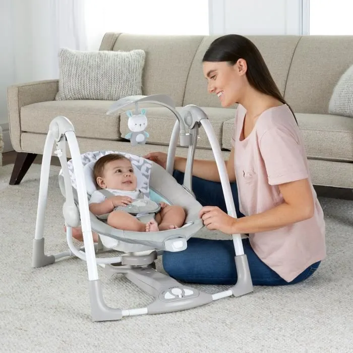 Ingenuity Balancelle compacte bébé Raylan, balancement automatique, moteur silencieux, 12 mélodies et sons naturels