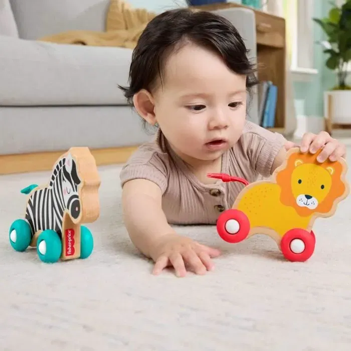 Fisher-Price JFN19 - Pack de 2 animaux à pousser en bois (lion et zèbre) avec queue en silicone, jouet d'éveil pour enfants à partir de 12 mois