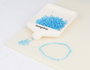Innspiro Rocaille de verre cylindre mini aurora boreale bleu clair diam. 2x2mm, 100g Pot