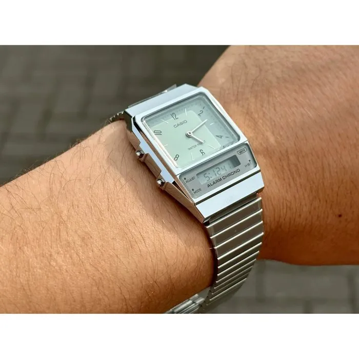 Casio AQ - Montre mixte digitale à quartz verte - Chronomètre, alarme, double fuseau horaire, bracelet acier