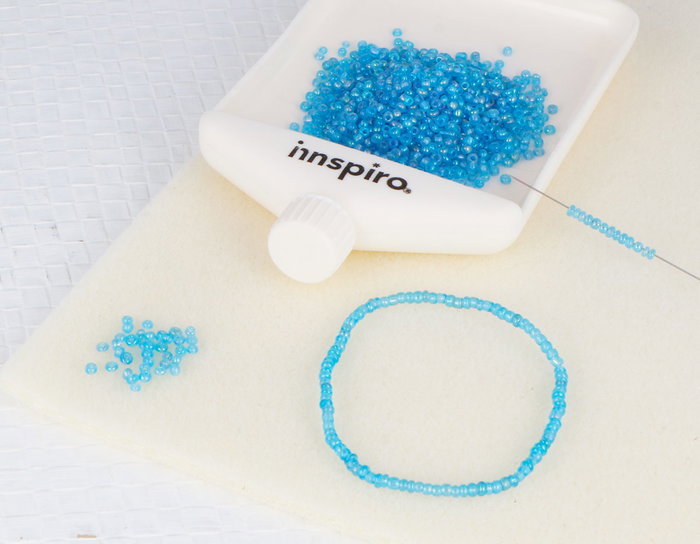 Innspiro Rocaille de verre ronde aurora boreale bleu 2,3mm 500g